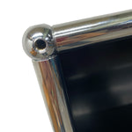 Load image into Gallery viewer, Close-up of a metallic frame corner with a reflective surface.
