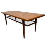 Load image into Gallery viewer, Wooden coffee table with magazine shelf on a white background
