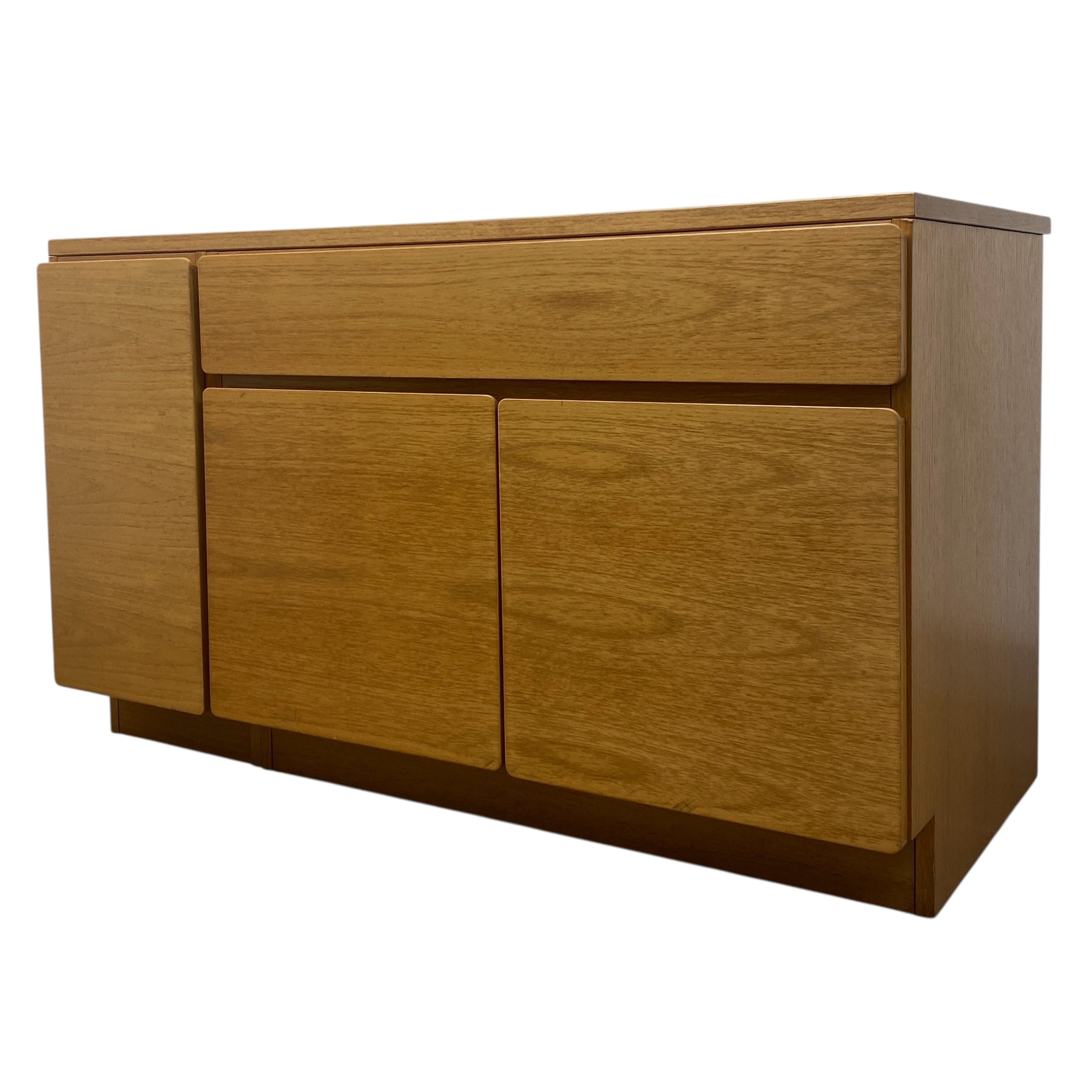 Wooden sideboard with three doors on a white background