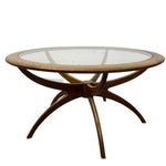 Load image into Gallery viewer, Round wooden table with glass top on a white background
