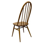Load image into Gallery viewer, Wooden chair with spindle back design on a white background
