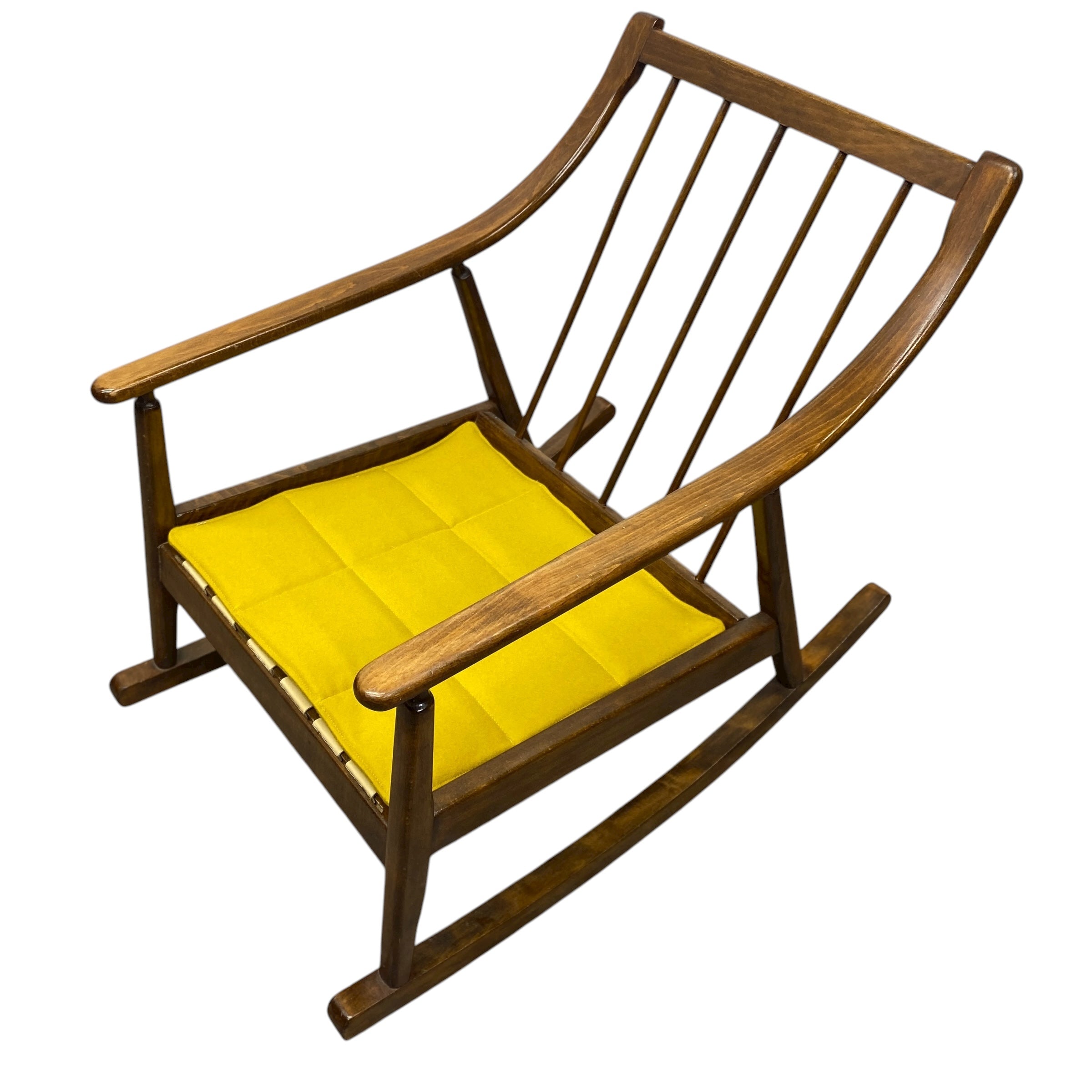Wooden rocking chair with a yellow cushion on a white background