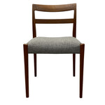 Load image into Gallery viewer, Wooden chair with a patterned gray cushion on a white background
