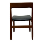 Load image into Gallery viewer, Wooden chair with a dark cushioned seat on a white background
