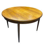 Load image into Gallery viewer, Round wooden table with four legs on a white background
