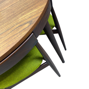 Wooden table with black legs on a white background