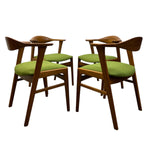 Load image into Gallery viewer, Four wooden chairs with green cushions on a white background
