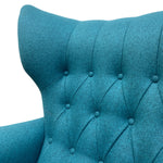 Load image into Gallery viewer, Close-up of a teal upholstered chair with buttoned backrest on a white background
