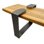 Load image into Gallery viewer, Wooden table with metal brackets on a white background
