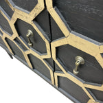 Load image into Gallery viewer, Black and gold geometric-patterned cabinet with two drawers.
