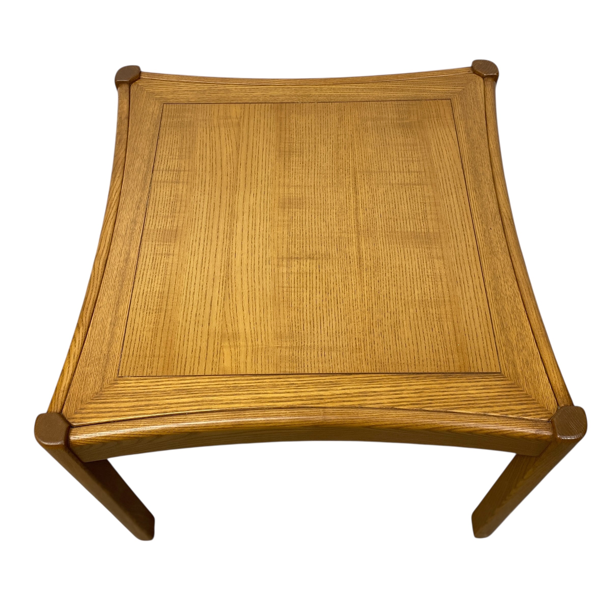 Wooden stool with woven top on a white background