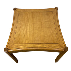 Wooden stool with woven top on a white background