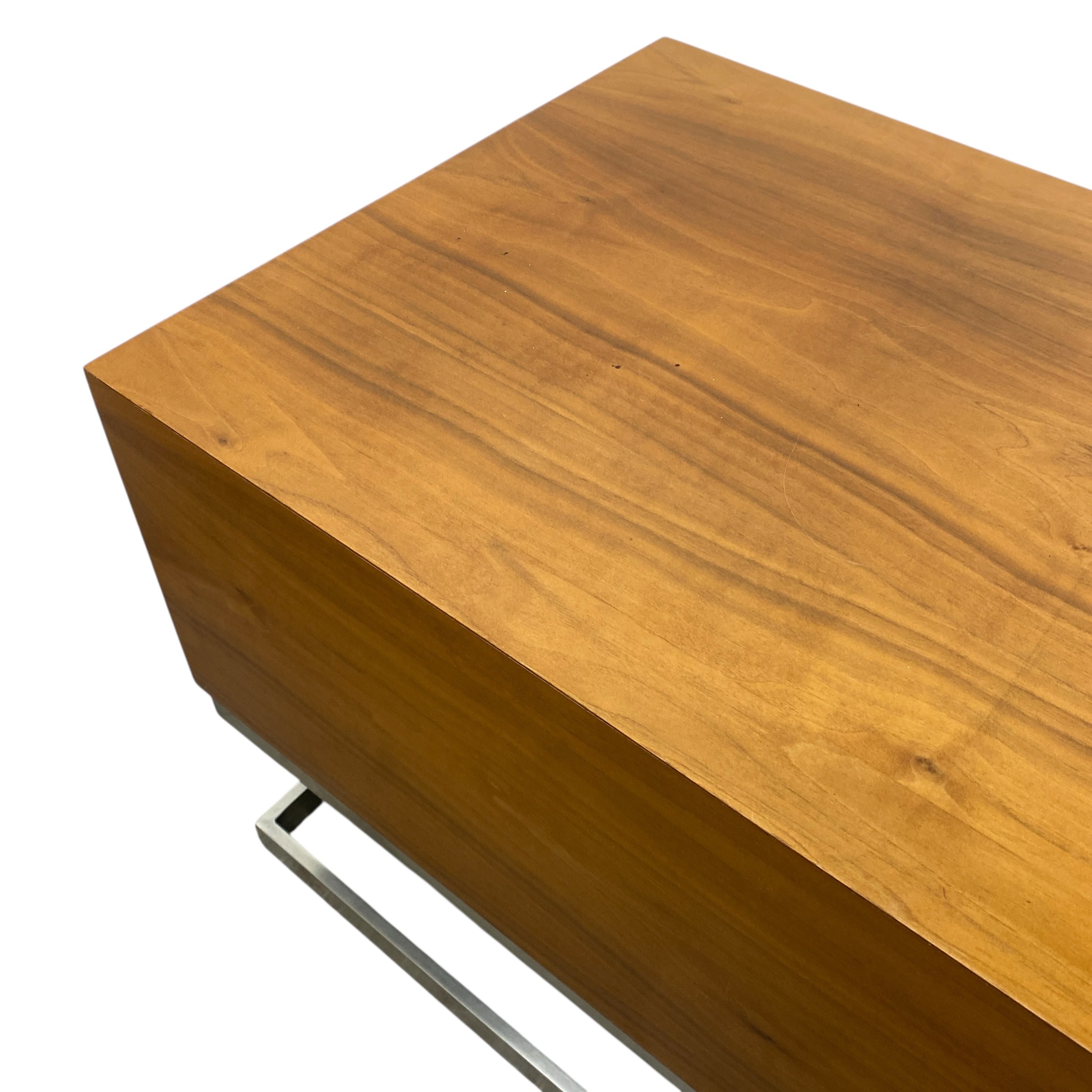 Wooden surface with a metal leg on a white background