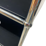 Load image into Gallery viewer, Close-up of a black and chrome chair corner on a white background
