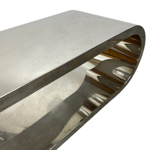Metallic console table with a reflective surface on a white background