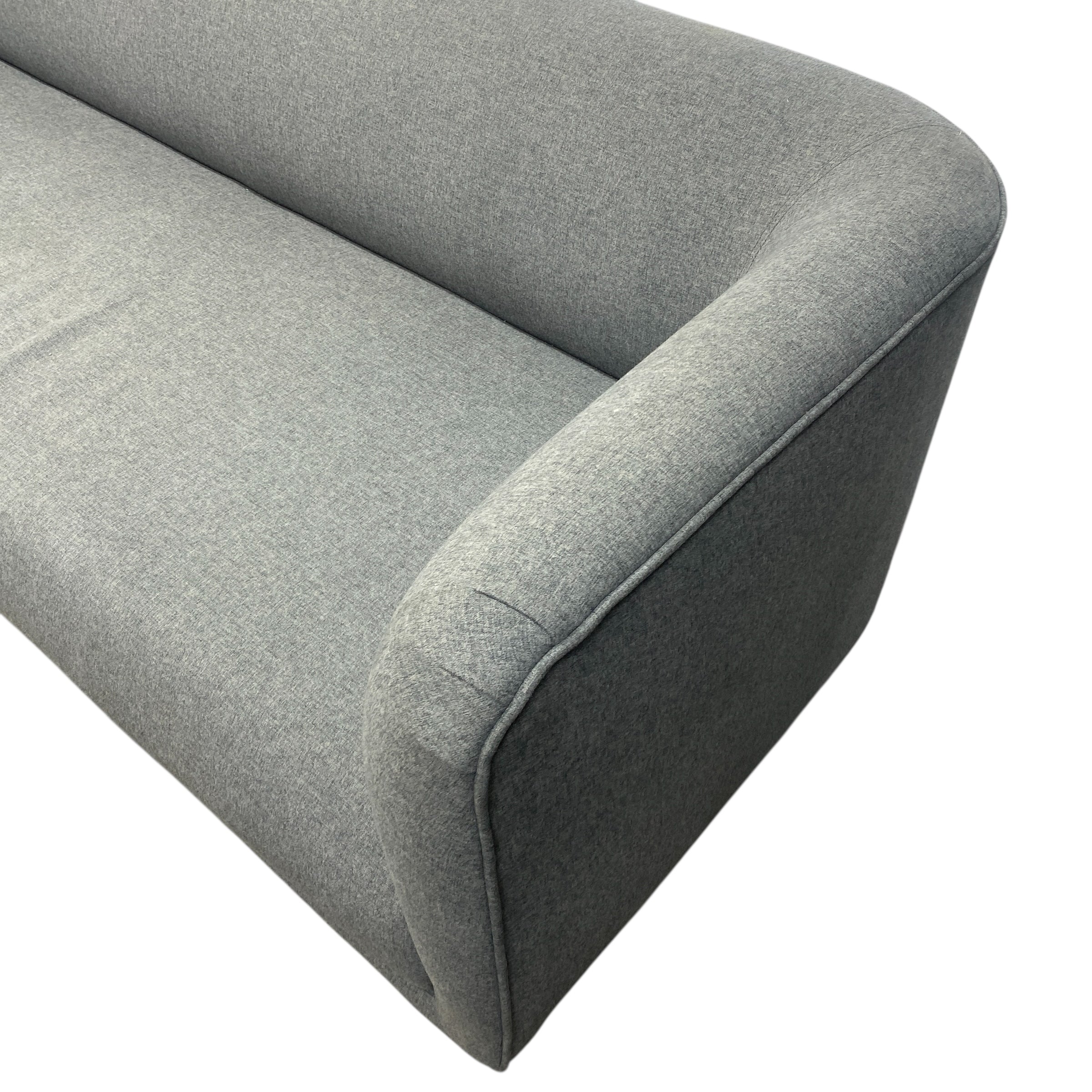 Gray fabric sofa corner on a white background
