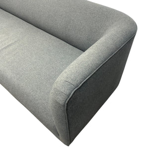 Gray fabric sofa corner on a white background