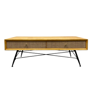 Wooden coffee table with wicker side panels on a white background