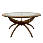 Load image into Gallery viewer, Round wooden table with glass top on a white background
