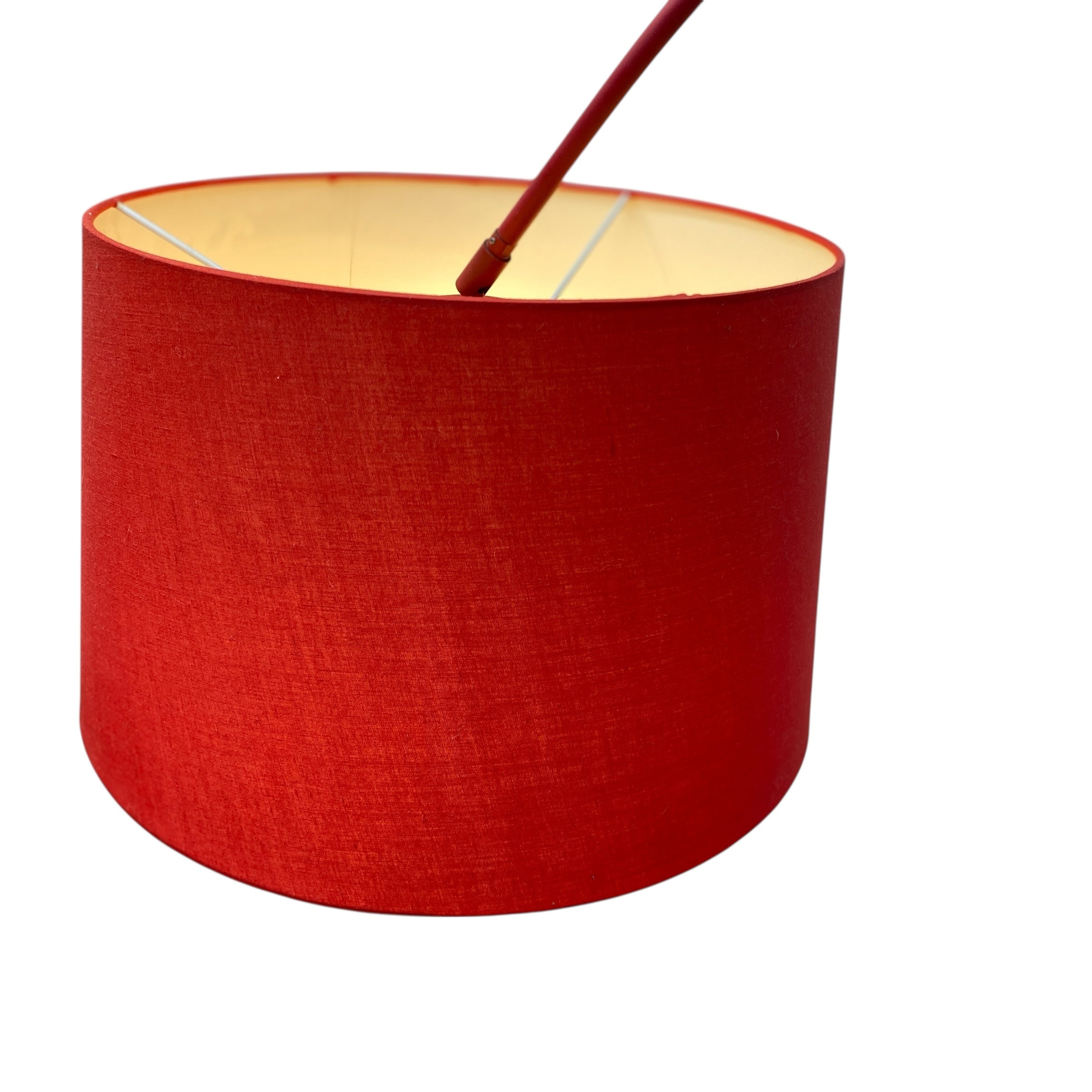 Red lampshade with a wooden stick on a white background