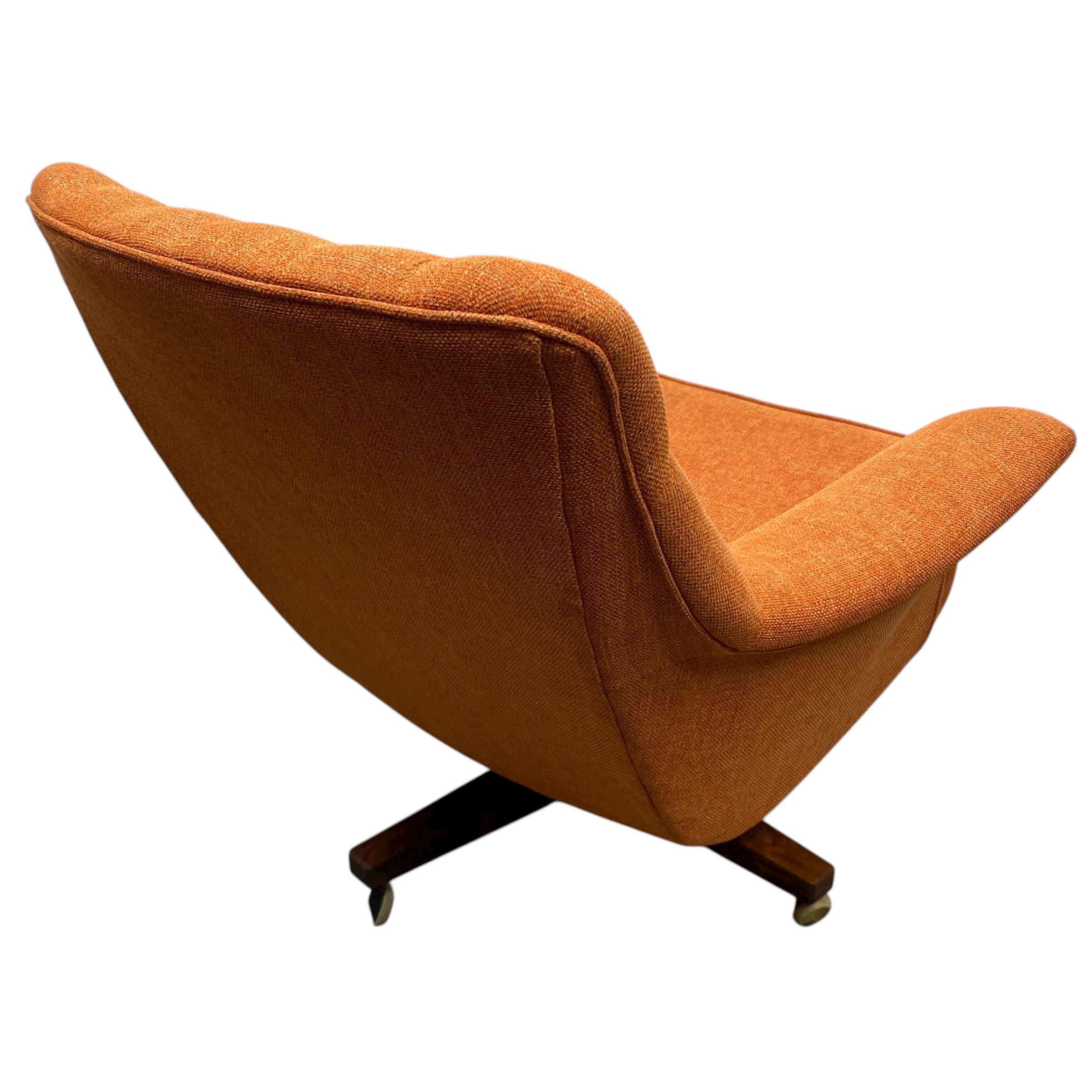 Orange swivel chair on a white background