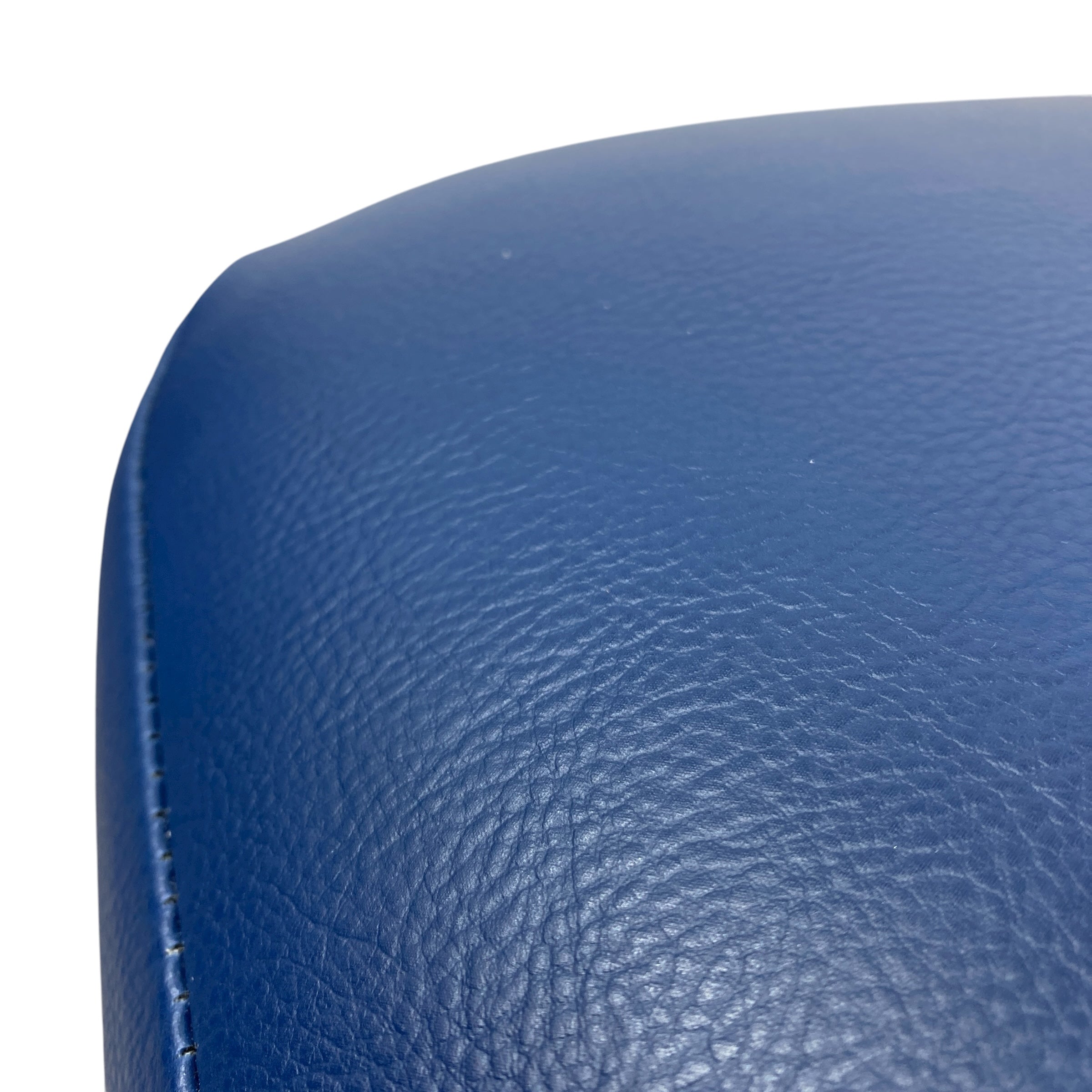 Close-up of a blue leather surface with visible texture