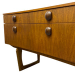 Load image into Gallery viewer, Wooden dresser with four drawers and metal handles on a white background
