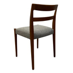 Load image into Gallery viewer, Wooden chair with a gray cushioned seat on a white background
