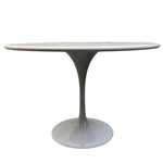 Load image into Gallery viewer, Round table with a white marble top and black pedestal base on a white background
