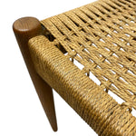 Load image into Gallery viewer, Close-up of a woven bench with wooden legs on a white background
