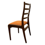 Load image into Gallery viewer, Wooden chair with an orange cushion on a white background
