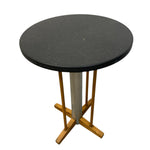 Load image into Gallery viewer, Round table with black top and wooden base on a white background
