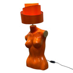 Load image into Gallery viewer, Orange lamp shaped like a female torso on a white background
