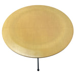 Load image into Gallery viewer, Round gold table with a black metal leg on a white background
