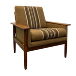 Load image into Gallery viewer, Brown armchair with striped cushions on a white background

