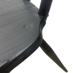 Load image into Gallery viewer, Close-up of a black chair with a textured surface on a white background
