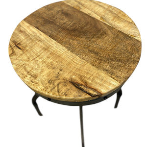 Round wooden stool with a natural finish on a white background