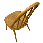Load image into Gallery viewer, Wooden chair with curved backrest on a white background
