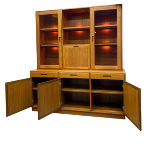 Wooden cabinet with open doors on a white background