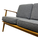 Load image into Gallery viewer, Grey cushioned sofa with wooden frame on a white background
