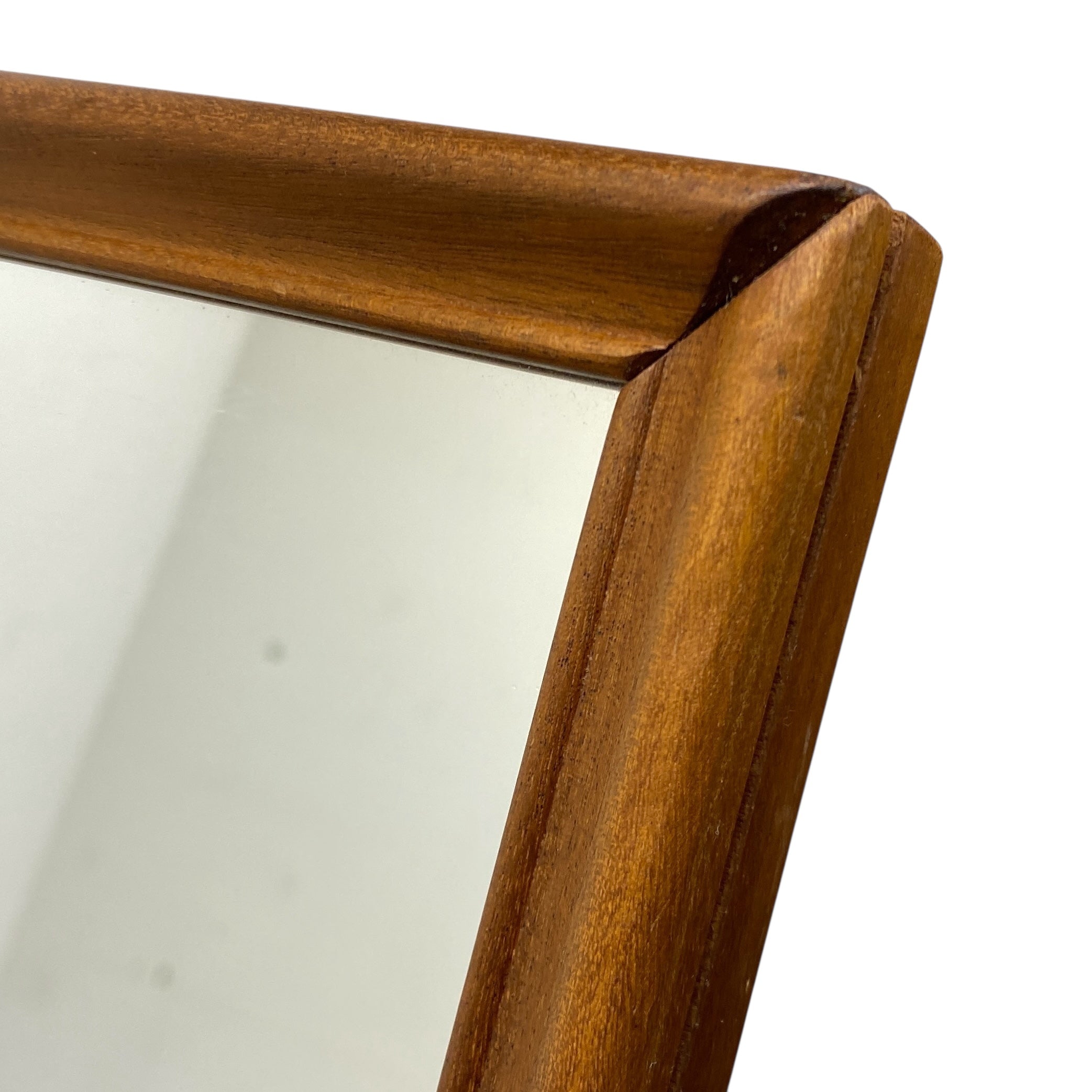 Wooden-framed mirror corner on a white background