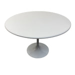Load image into Gallery viewer, White round table with a pedestal base on a white background
