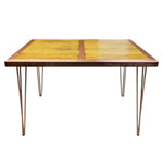 Load image into Gallery viewer, Square table with a wooden top and metal legs on a white background

