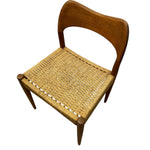 Load image into Gallery viewer, Wooden chair with wicker seat on a white background
