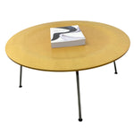Load image into Gallery viewer, Eames Round wooden coffee table with a book on top against a white background
