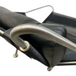 Load image into Gallery viewer, Close-up of a black leather chair with a metal armrest on a white background
