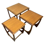 Load image into Gallery viewer, Set of three wooden nesting tables on a white background
