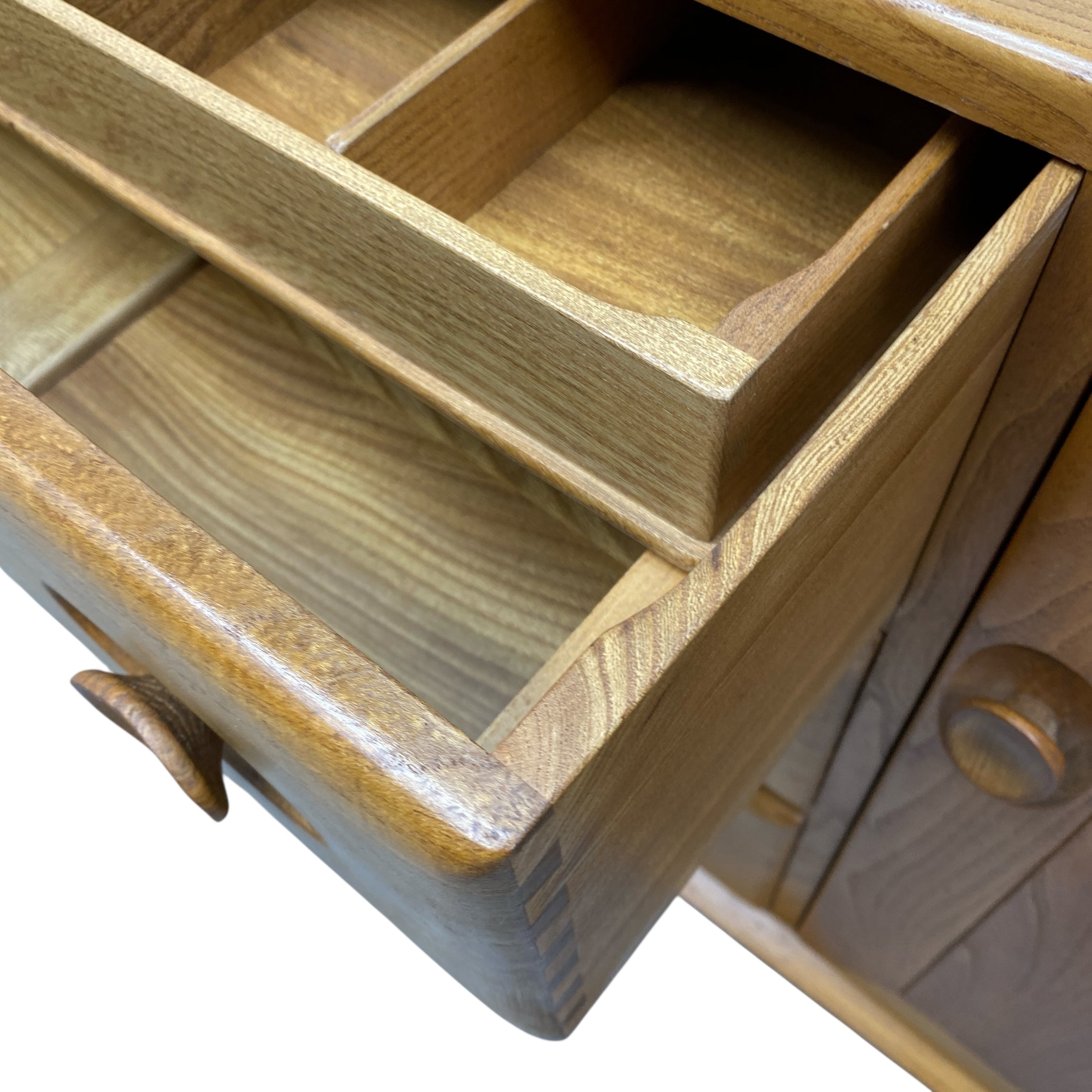 Wooden drawer with compartments on a white background
