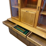 Load image into Gallery viewer, Wooden cabinet with open drawers and glass panels on a white background
