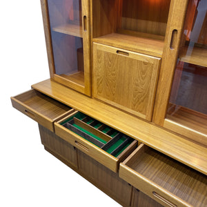 Wooden cabinet with open drawers and glass panels on a white background